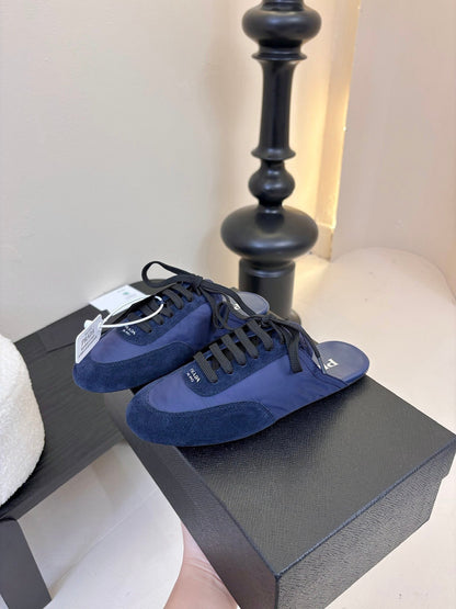 PRADA SNEAKER MULES IN NAVY BLUE NYLON AND SUEDE