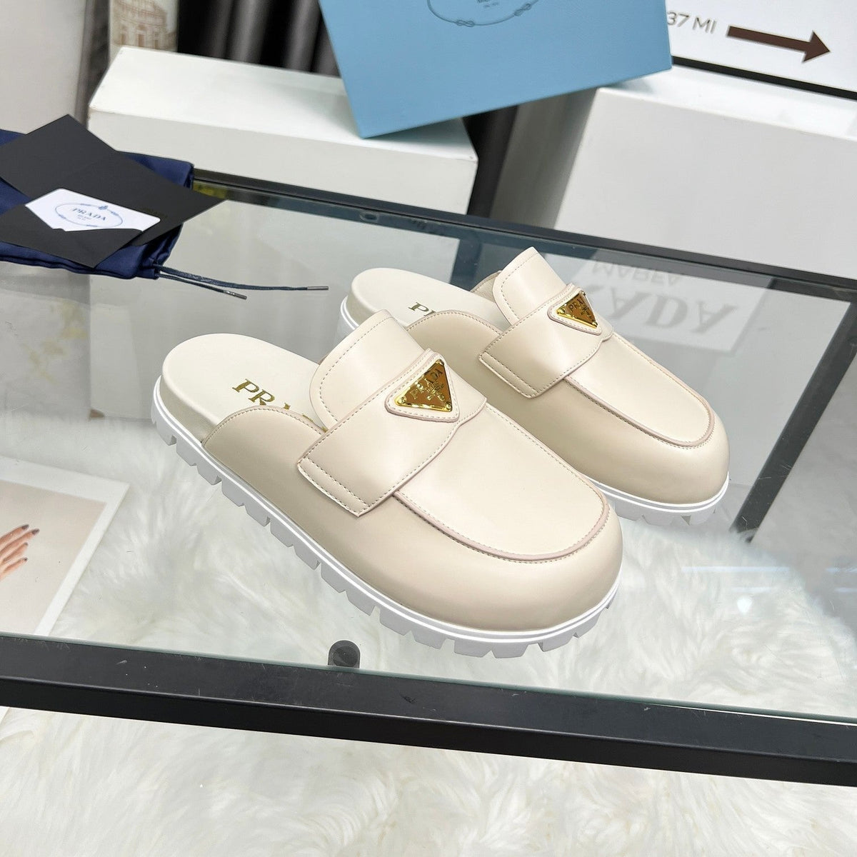 PRADA SABOTS MULES BEIGE CALFSKIN