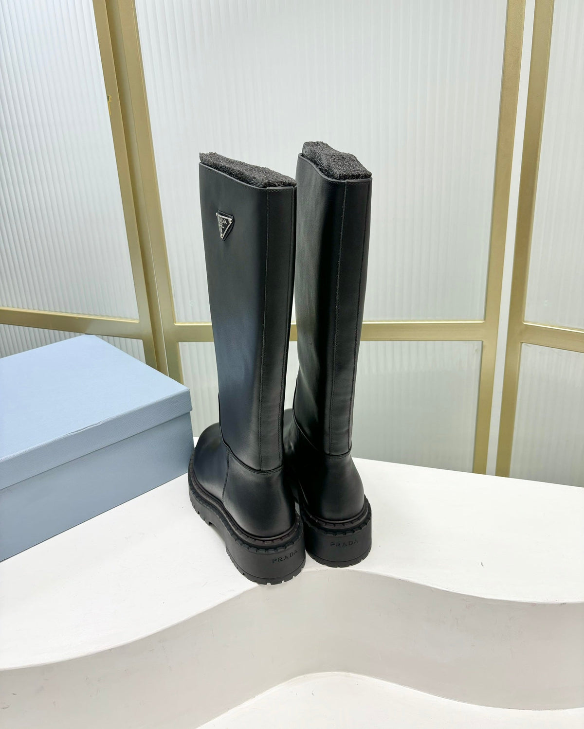PRADA KNEE BOOTS WITH TRIANGLE LOGO IN BLACK CALFSKIN