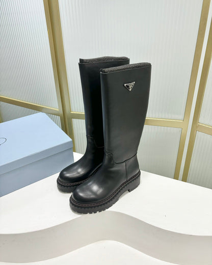 PRADA KNEE BOOTS WITH TRIANGLE LOGO IN BLACK CALFSKIN