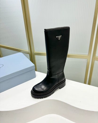 PRADA KNEE BOOTS WITH TRIANGLE LOGO IN BLACK CALFSKIN