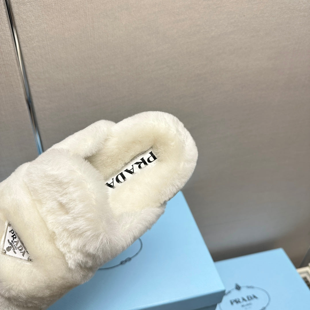 PRADA FLAT MULES IN WHITE RABBIT FUR
