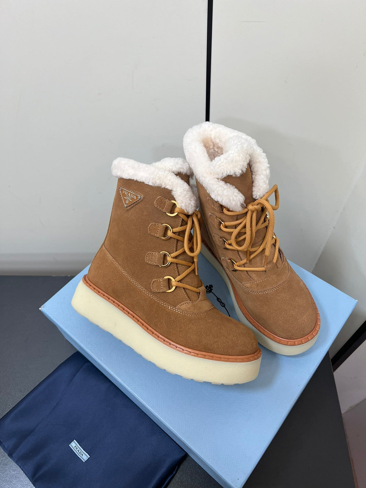 PRADA LACE-UP ANKLE BOOTS IN CAMEL SUEDE AND SHEARLING LINING