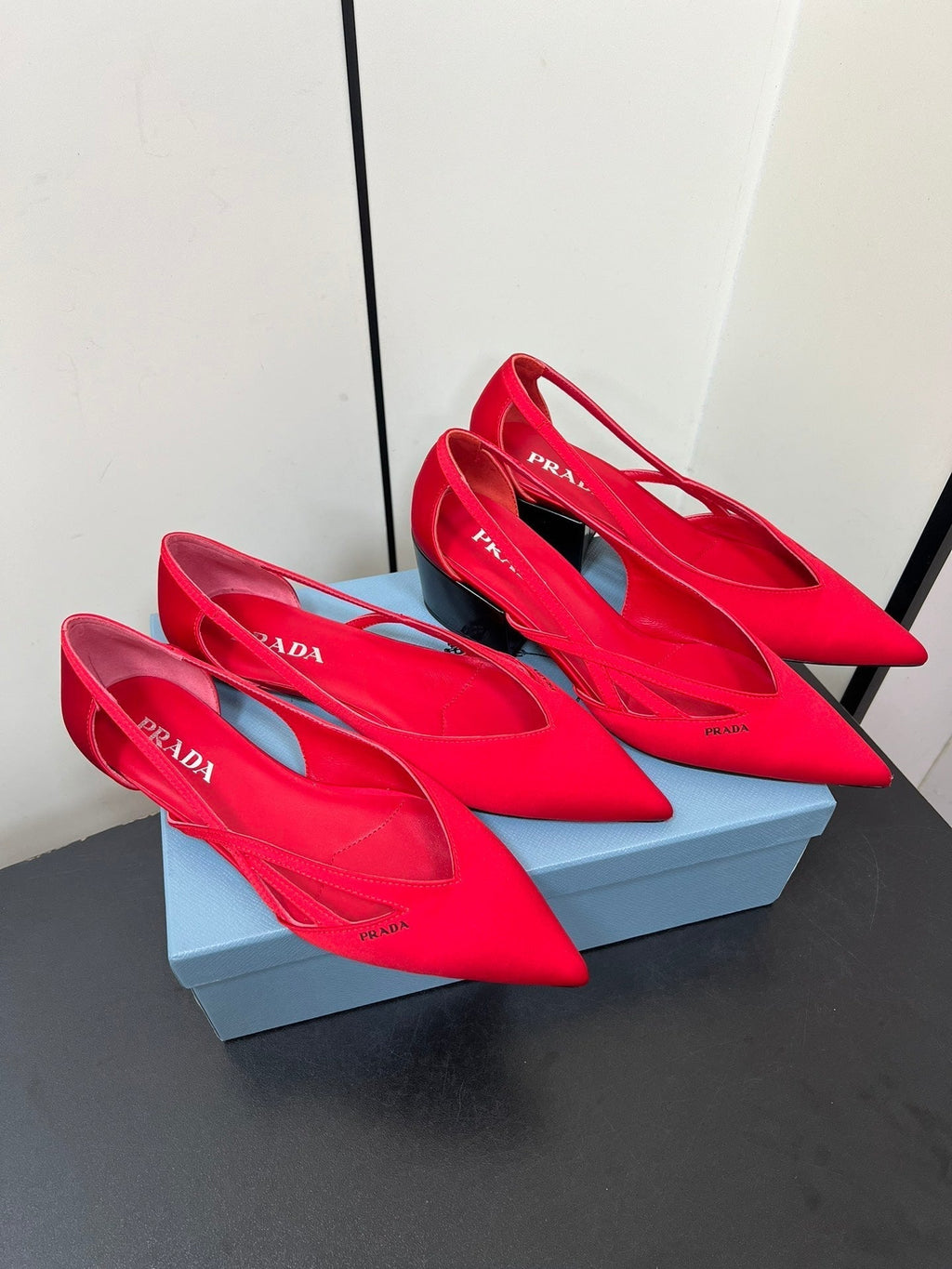 PRADA CUT-OUT BALLERINAS IN RED SATIN