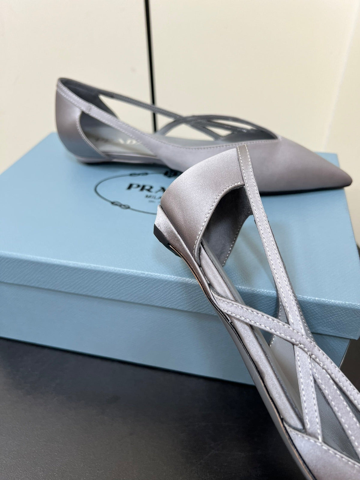 PRADA CUT-OUT BALLERINAS IN WARM GRAY SATIN