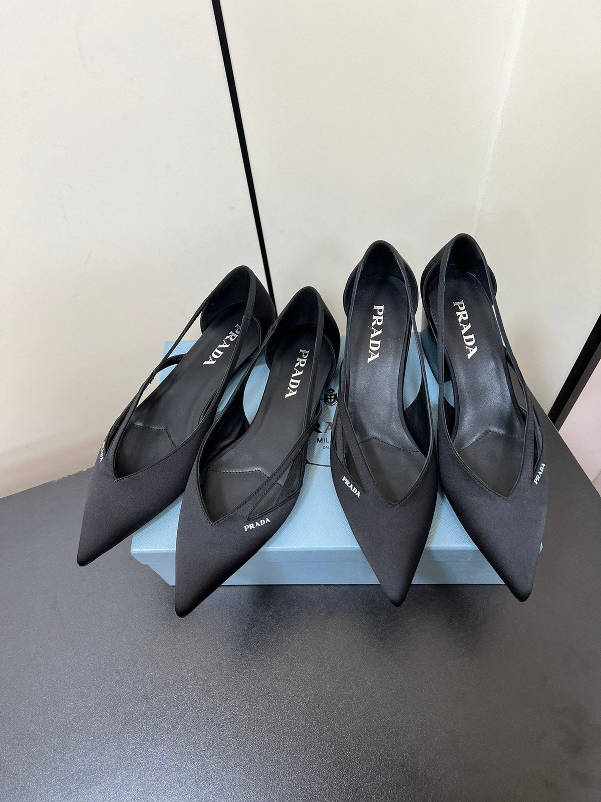 PRADA CUT-OUT BALLERINAS IN BLACK SATIN