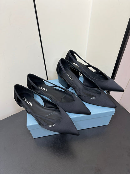 PRADA CUT-OUT BALLERINAS IN BLACK SATIN
