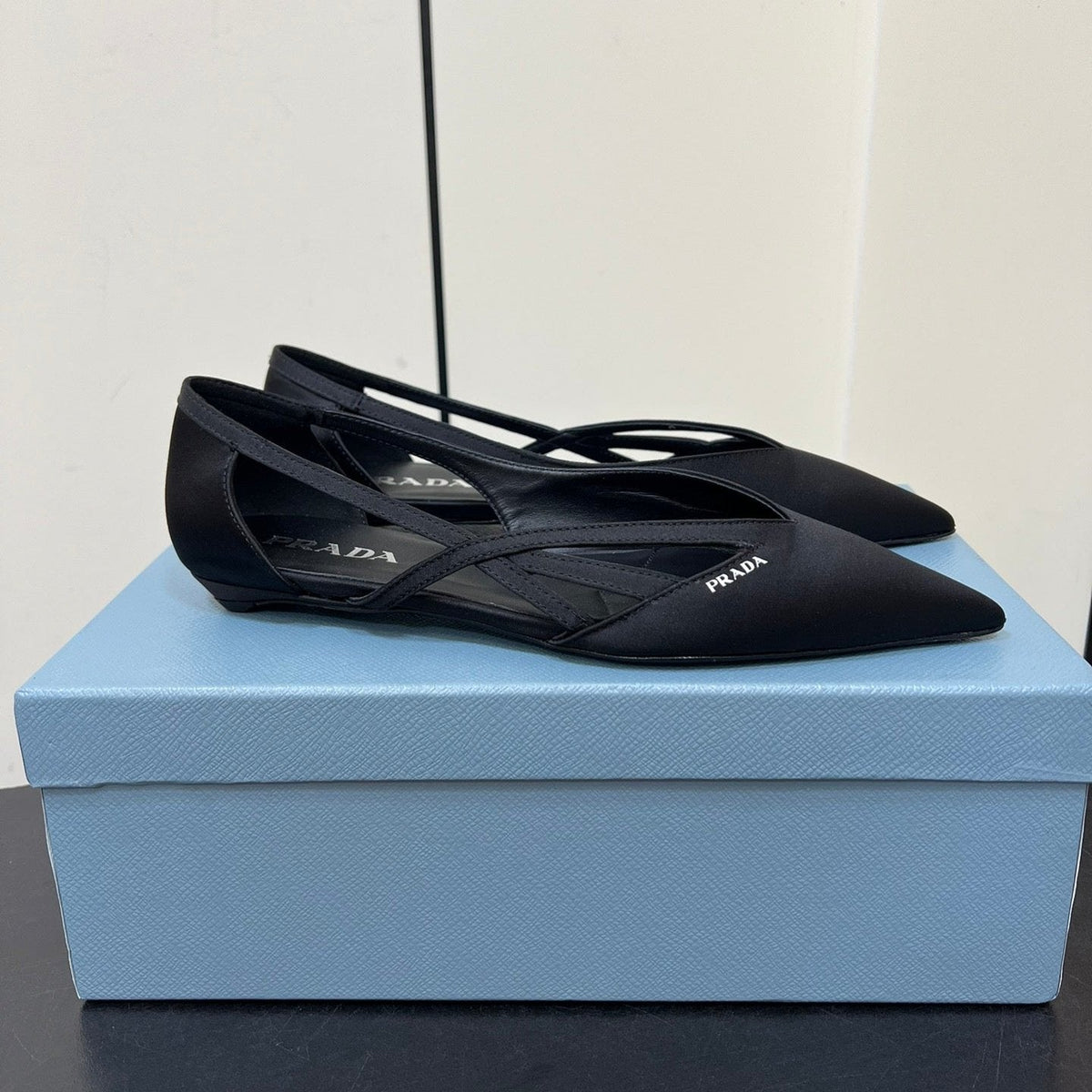 PRADA CUT-OUT BALLERINAS IN BLACK SATIN