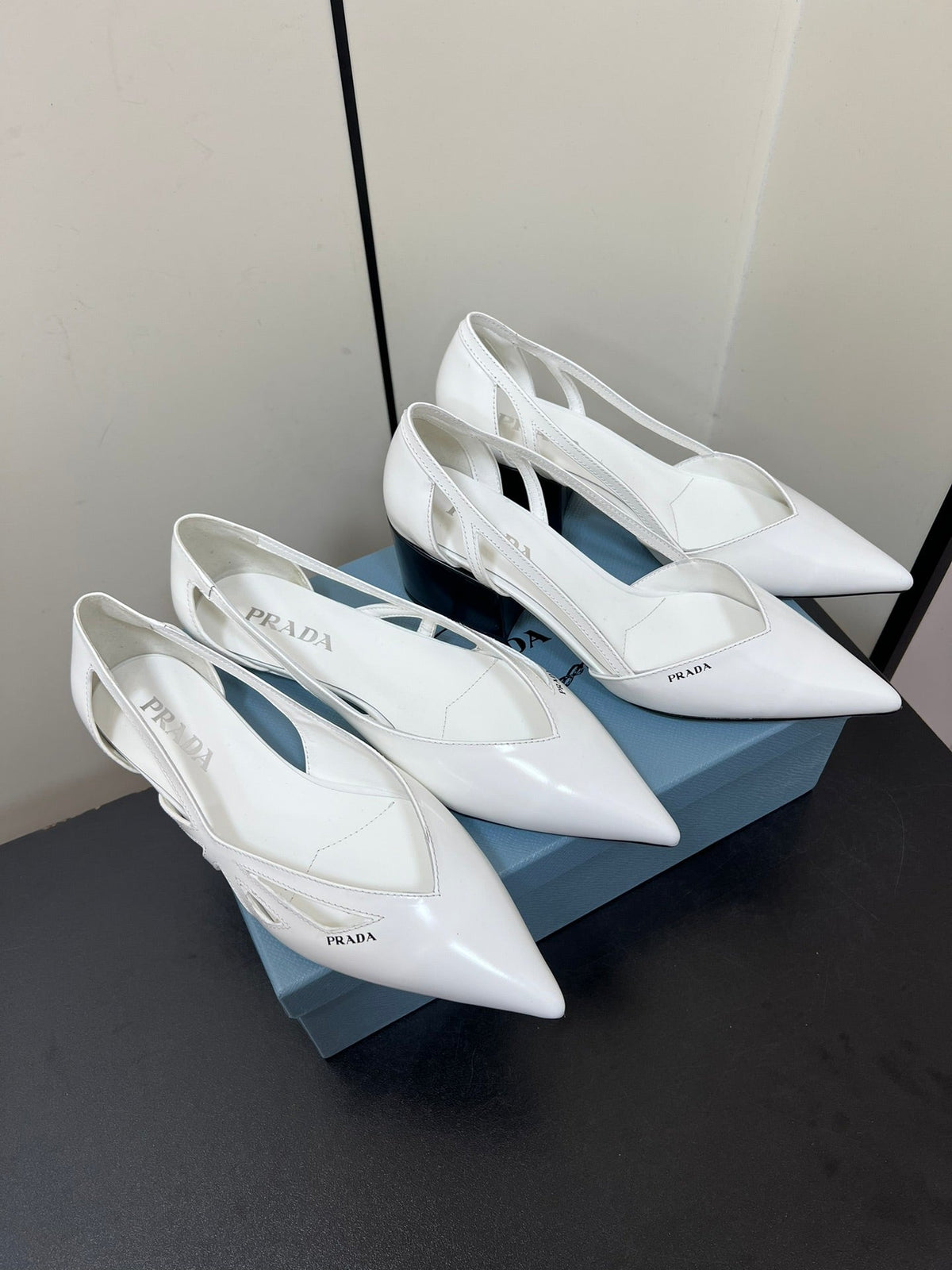 PRADA BRUSHED CUT-OUT BALLERINA FLAT IN WHITE CALFSKIN