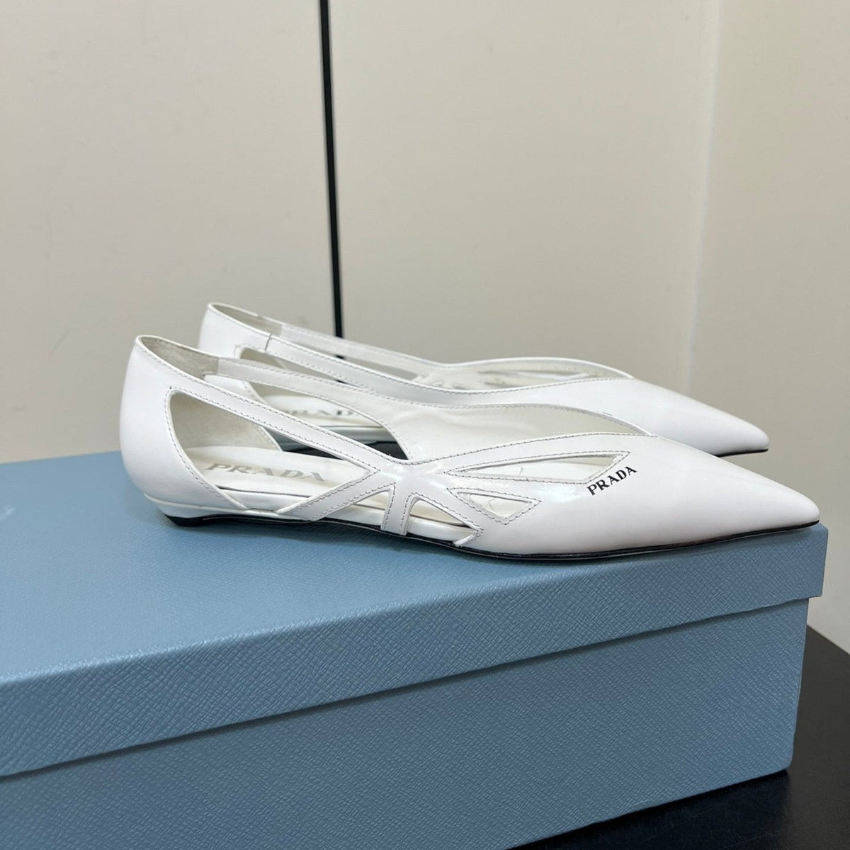 PRADA BRUSHED CUT-OUT BALLERINA FLAT IN WHITE CALFSKIN