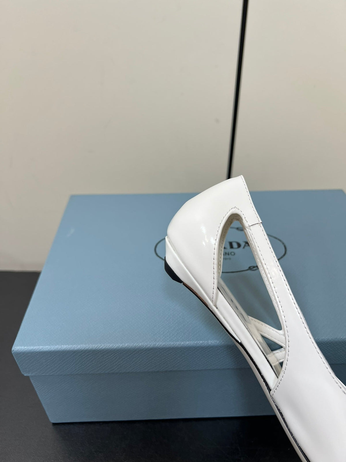 PRADA BRUSHED CUT-OUT BALLERINA FLAT IN WHITE CALFSKIN