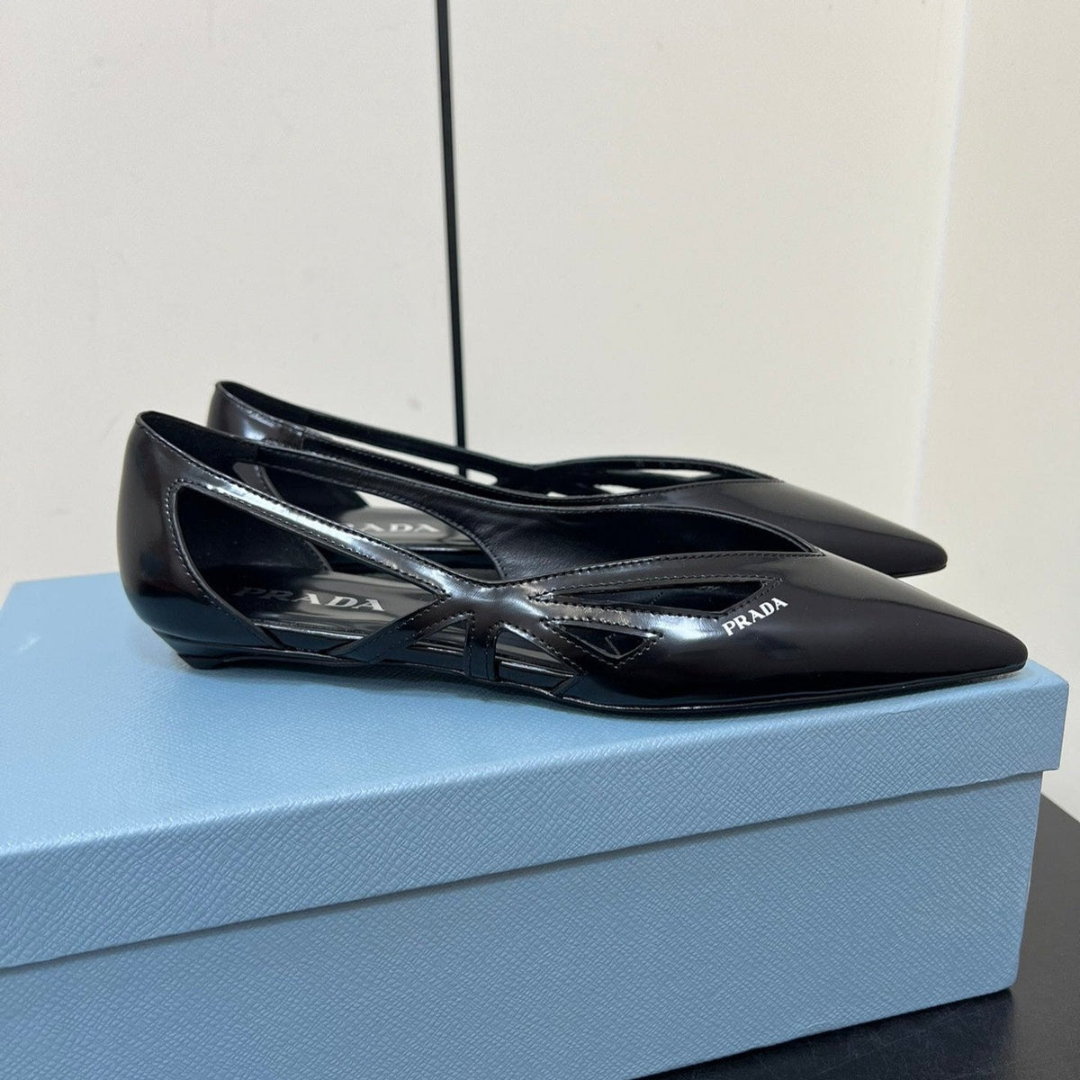 PRADA BRUSHED CUT-OUT BALLERINA FLAT IN BLACK CALFSKIN