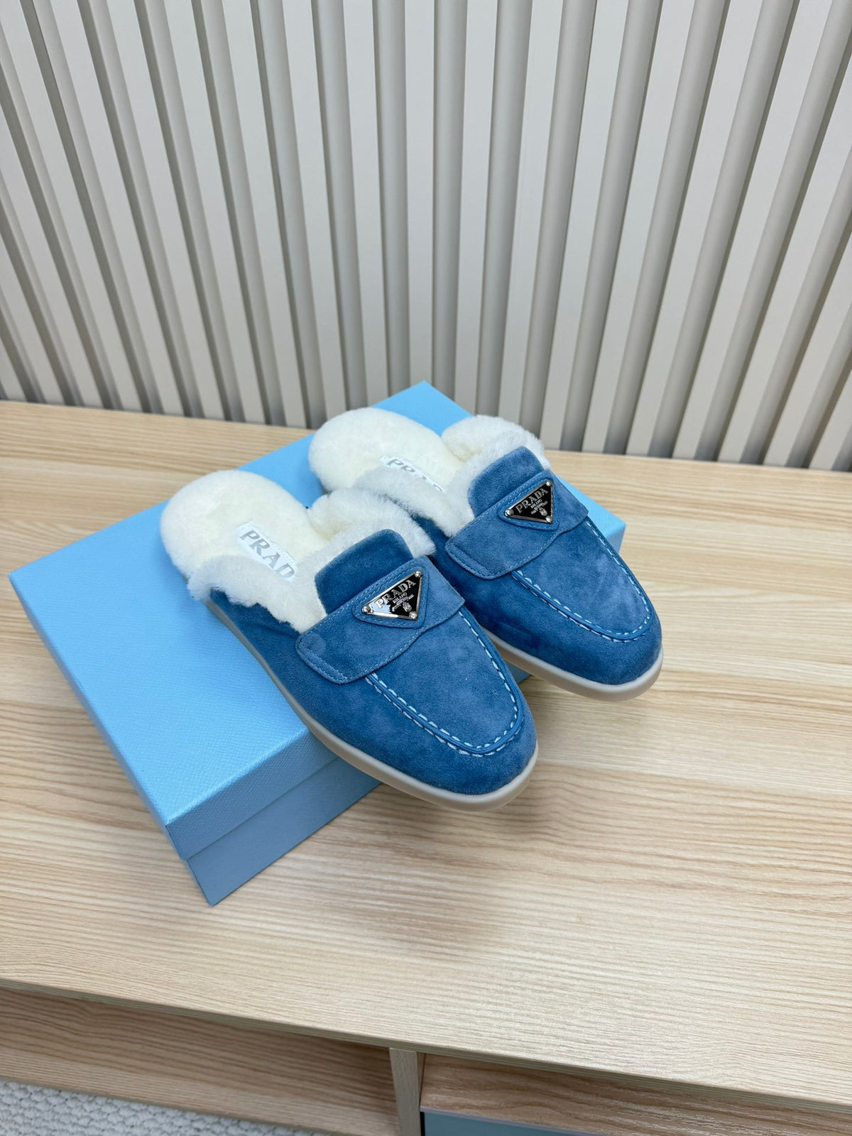PRADA TRIANGLE LOGO FLATS IN AZURE BLUE SUEDE AND FUR LINING