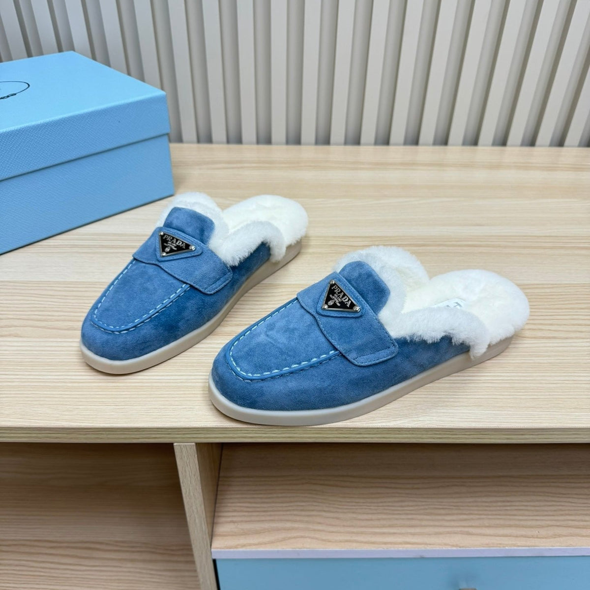 PRADA TRIANGLE LOGO FLATS IN AZURE BLUE SUEDE AND FUR LINING