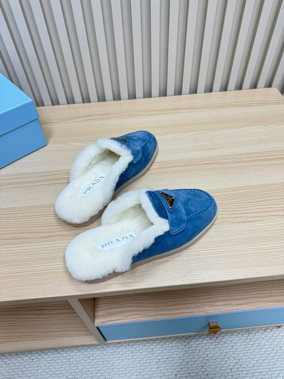 PRADA TRIANGLE LOGO FLATS IN AZURE BLUE SUEDE AND FUR LINING