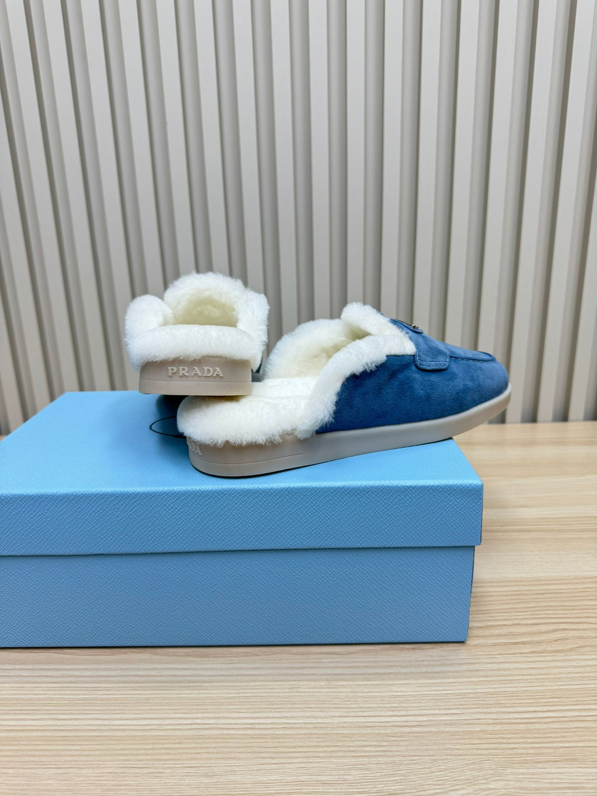 PRADA TRIANGLE LOGO FLATS IN AZURE BLUE SUEDE AND FUR LINING