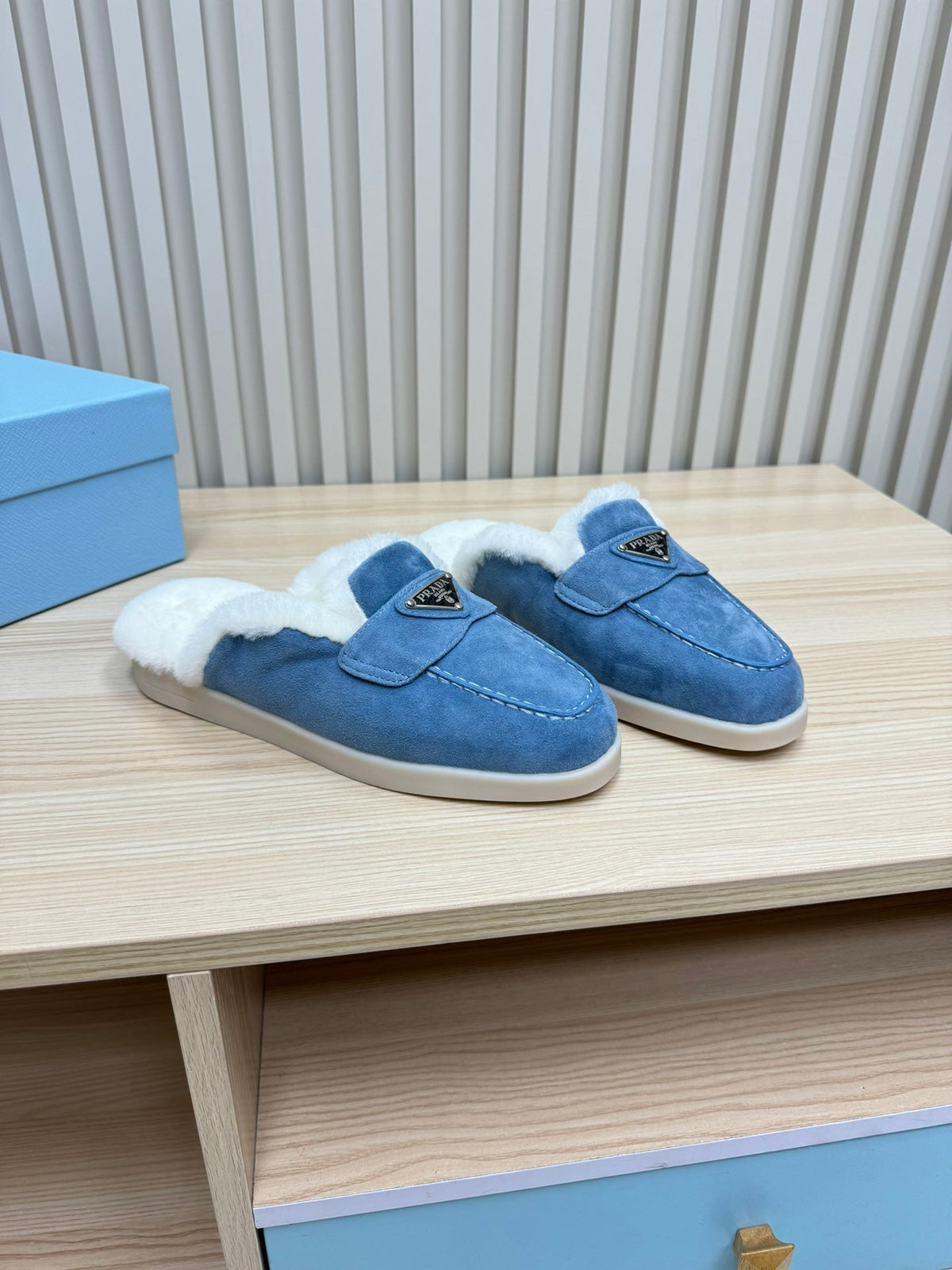 PRADA TRIANGLE LOGO FLATS IN AZURE BLUE SUEDE AND FUR LINING