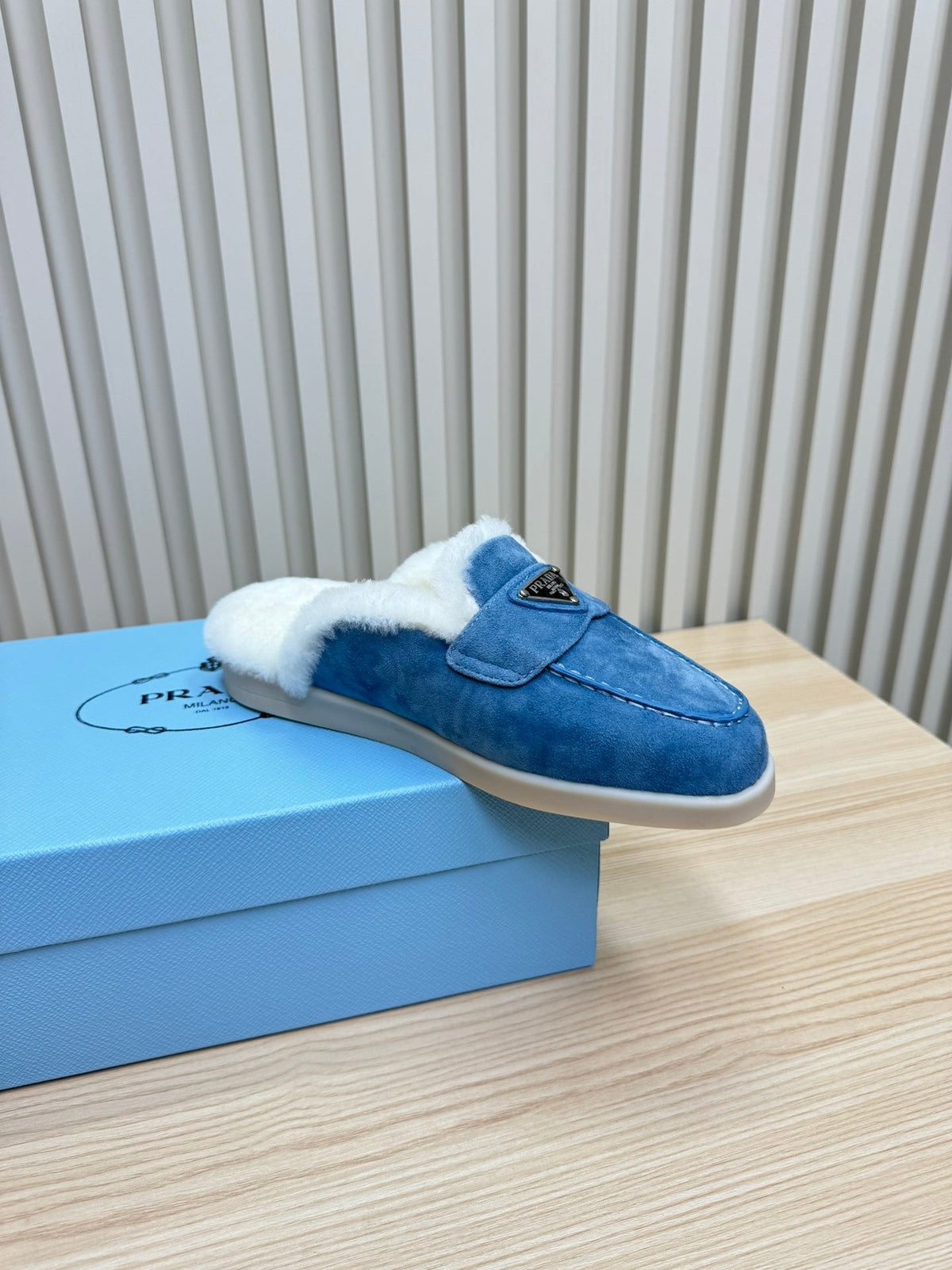 PRADA TRIANGLE LOGO FLATS IN AZURE BLUE SUEDE AND FUR LINING