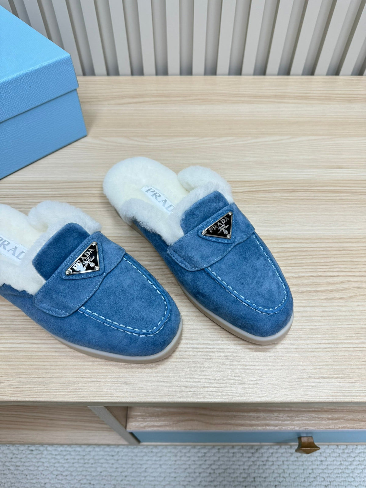 PRADA TRIANGLE LOGO FLATS IN AZURE BLUE SUEDE AND FUR LINING
