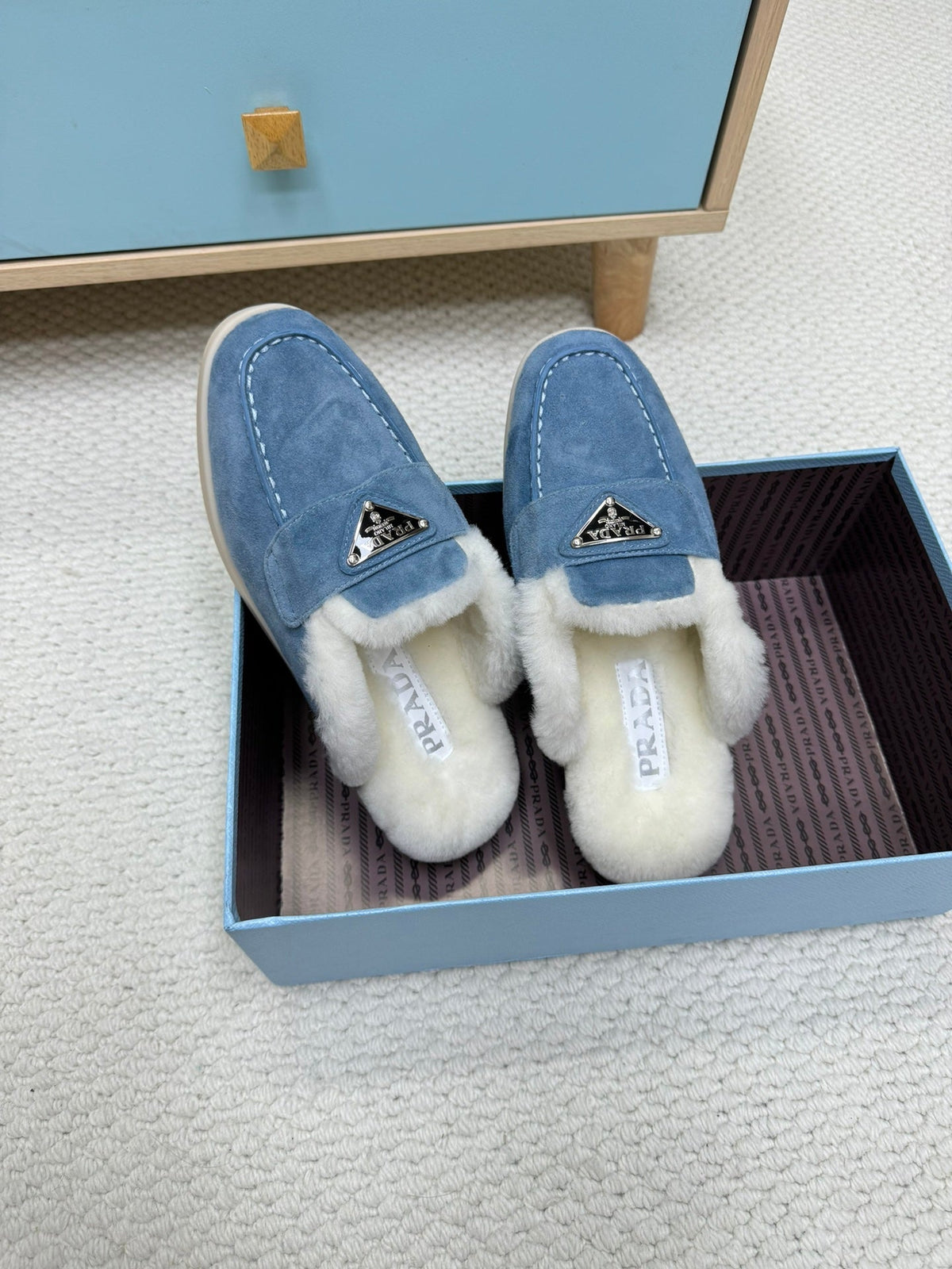 PRADA TRIANGLE LOGO FLATS IN AZURE BLUE SUEDE AND FUR LINING
