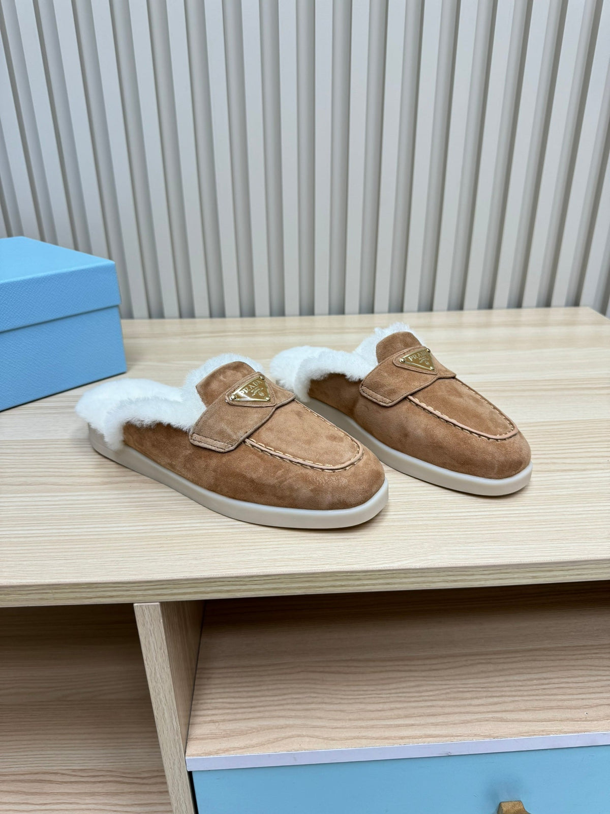 PRADA TRIANGLE LOGO FLATS IN CAMEL SUEDE AND FUR LINING