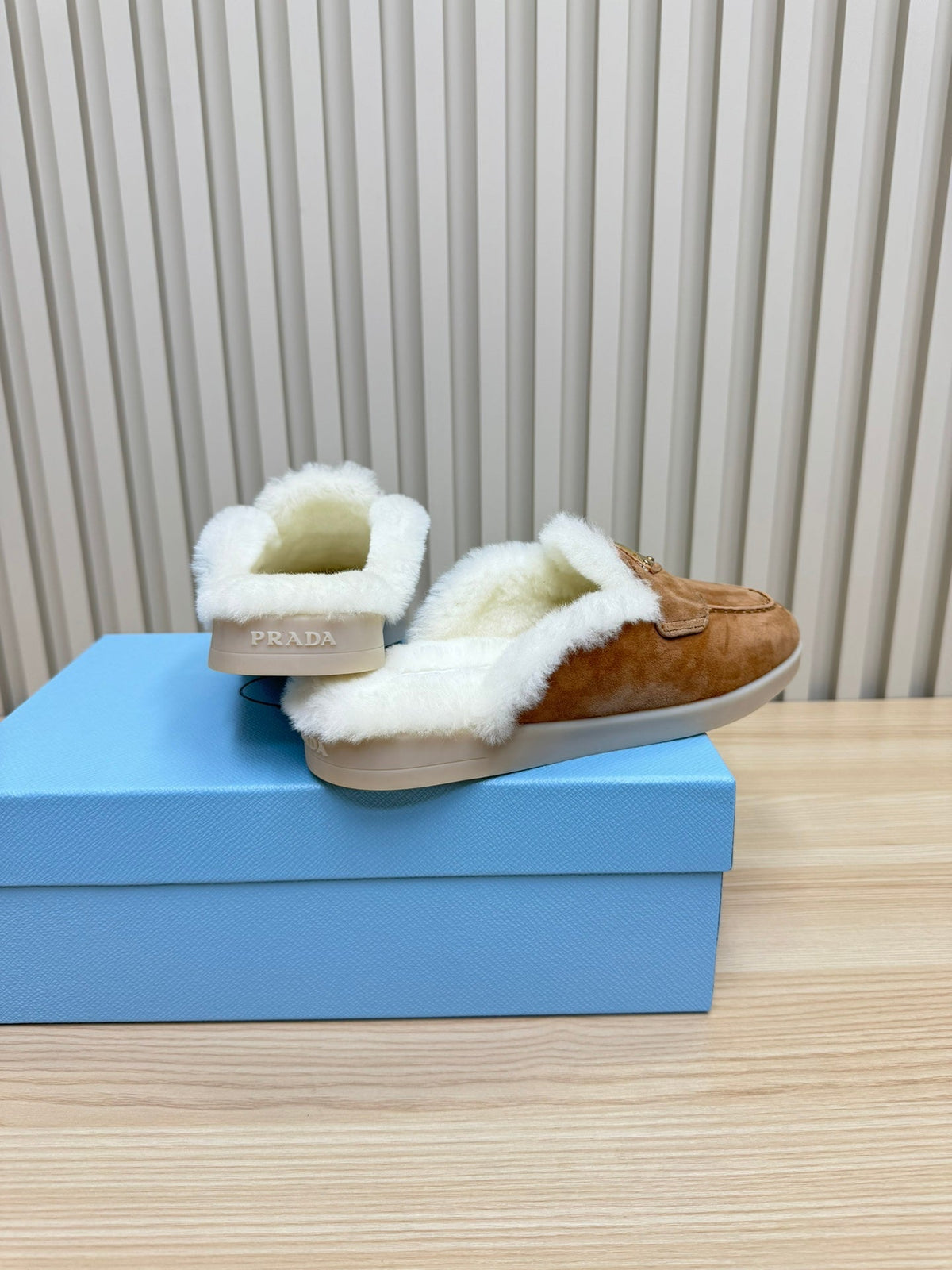 PRADA TRIANGLE LOGO FLATS IN CAMEL SUEDE AND FUR LINING