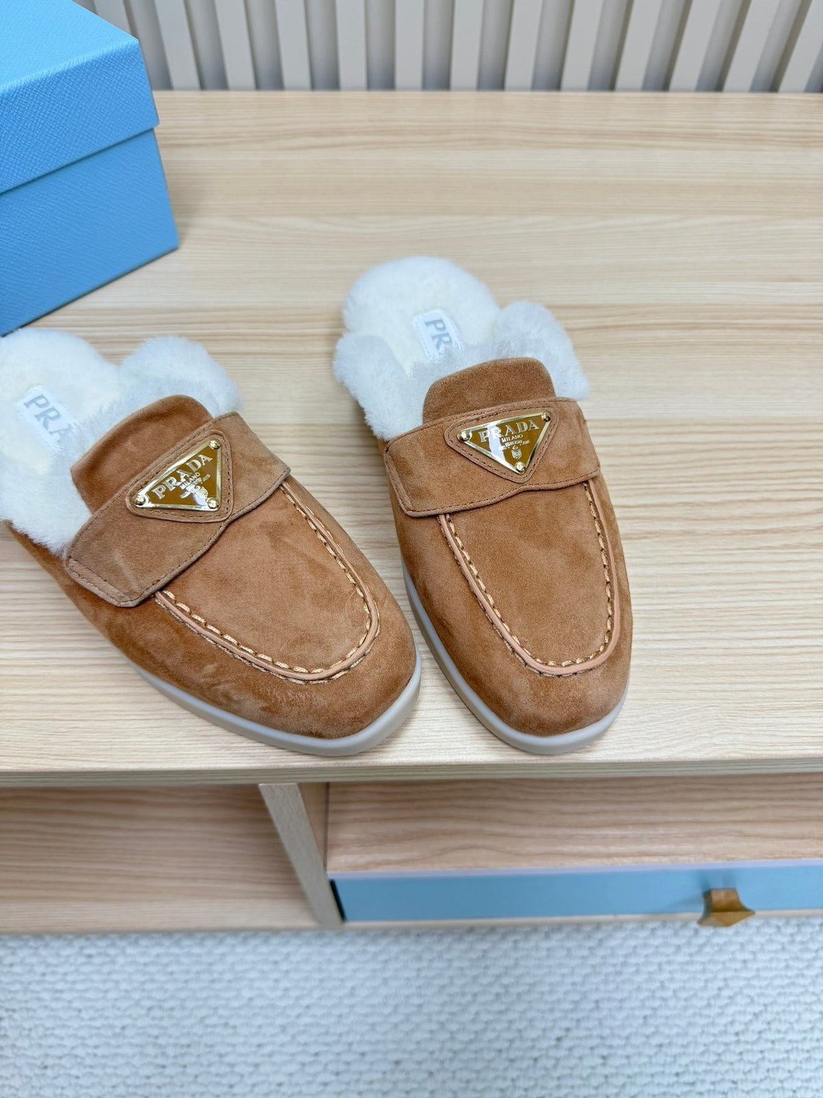 PRADA TRIANGLE LOGO FLATS IN CAMEL SUEDE AND FUR LINING
