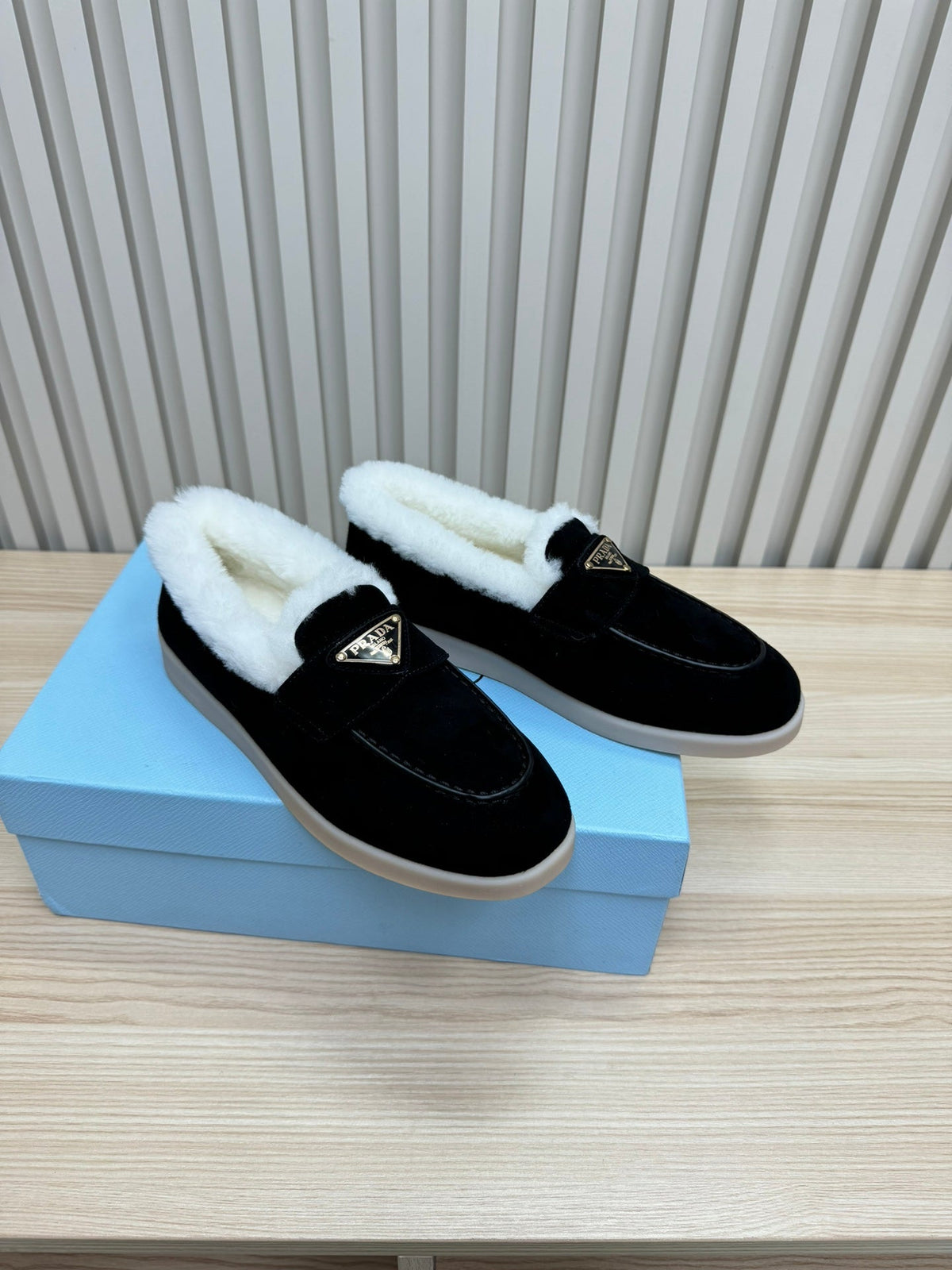 PRADA LOAFER IN BLACK SUEDE AND FUR LINING ATTACHED TRIANGLE LOGO