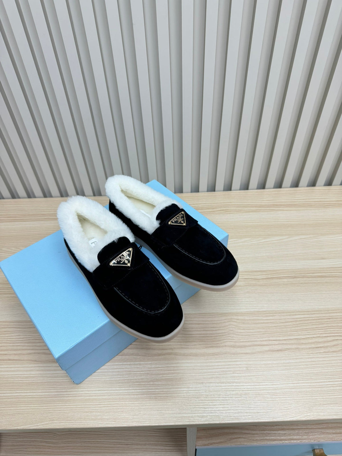 PRADA LOAFER IN BLACK SUEDE AND FUR LINING ATTACHED TRIANGLE LOGO