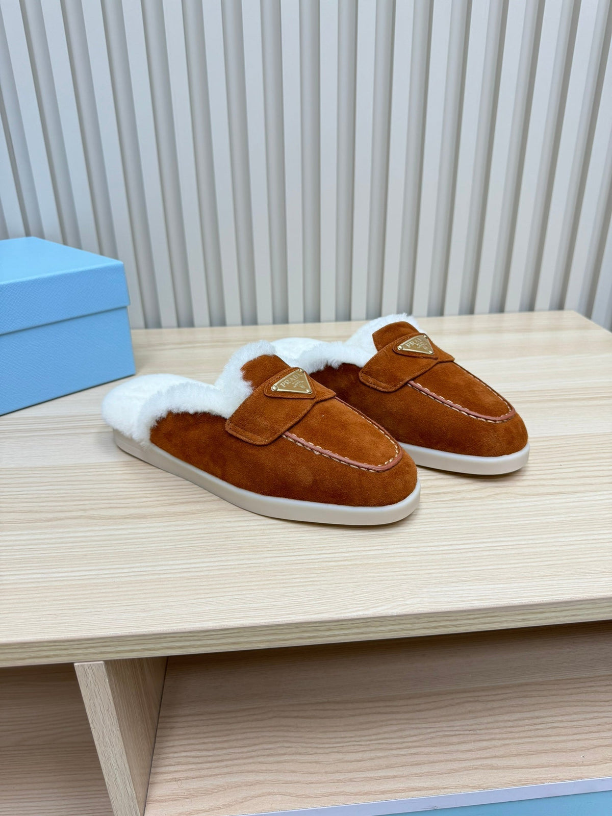 PRADA TRIANGLE LOGO FLATS IN RED BROWN SUEDE AND FUR LINING