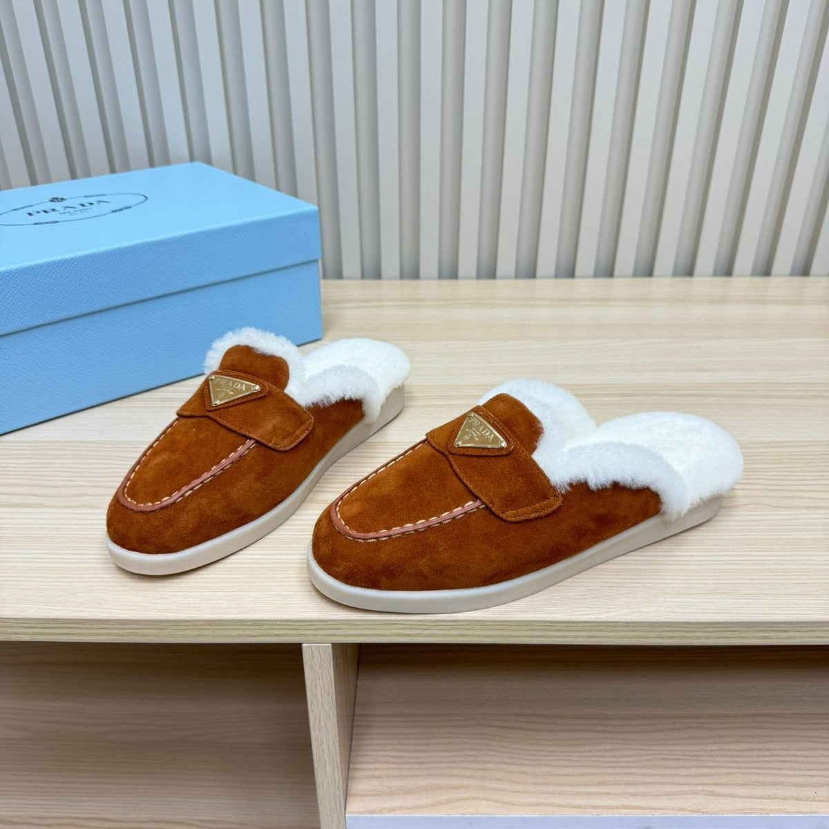 PRADA TRIANGLE LOGO FLATS IN RED BROWN SUEDE AND FUR LINING
