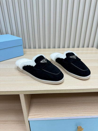PRADA TRIANGLE LOGO FLATS IN BLACK SUEDE AND FUR LINING