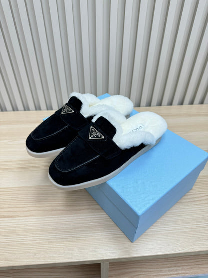 PRADA TRIANGLE LOGO FLATS IN BLACK SUEDE AND FUR LINING