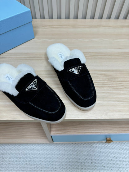 PRADA TRIANGLE LOGO FLATS IN BLACK SUEDE AND FUR LINING