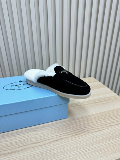 PRADA TRIANGLE LOGO FLATS IN BLACK SUEDE AND FUR LINING