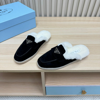 PRADA TRIANGLE LOGO FLATS IN BLACK SUEDE AND FUR LINING