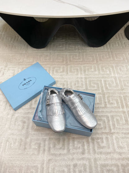 PRADA TASSEL LOAFERS IN SILVER METALLIC LAMBSKIN