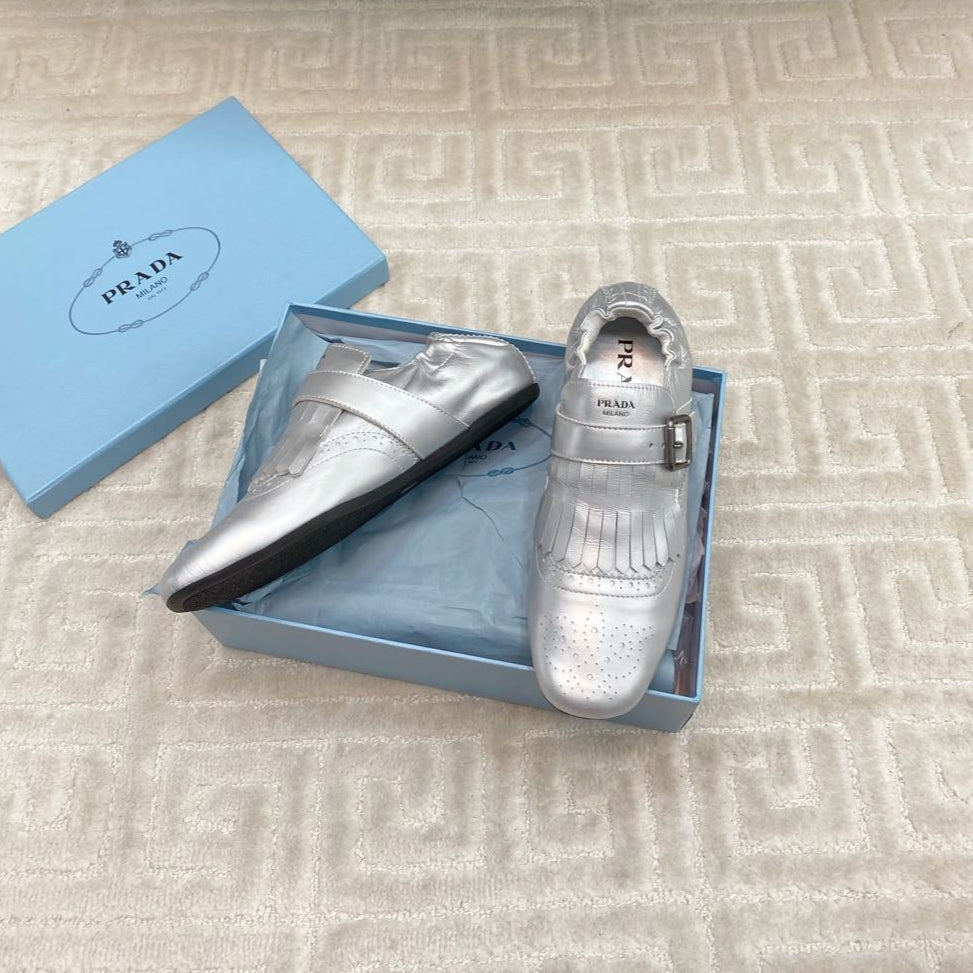 PRADA TASSEL LOAFERS IN SILVER METALLIC LAMBSKIN