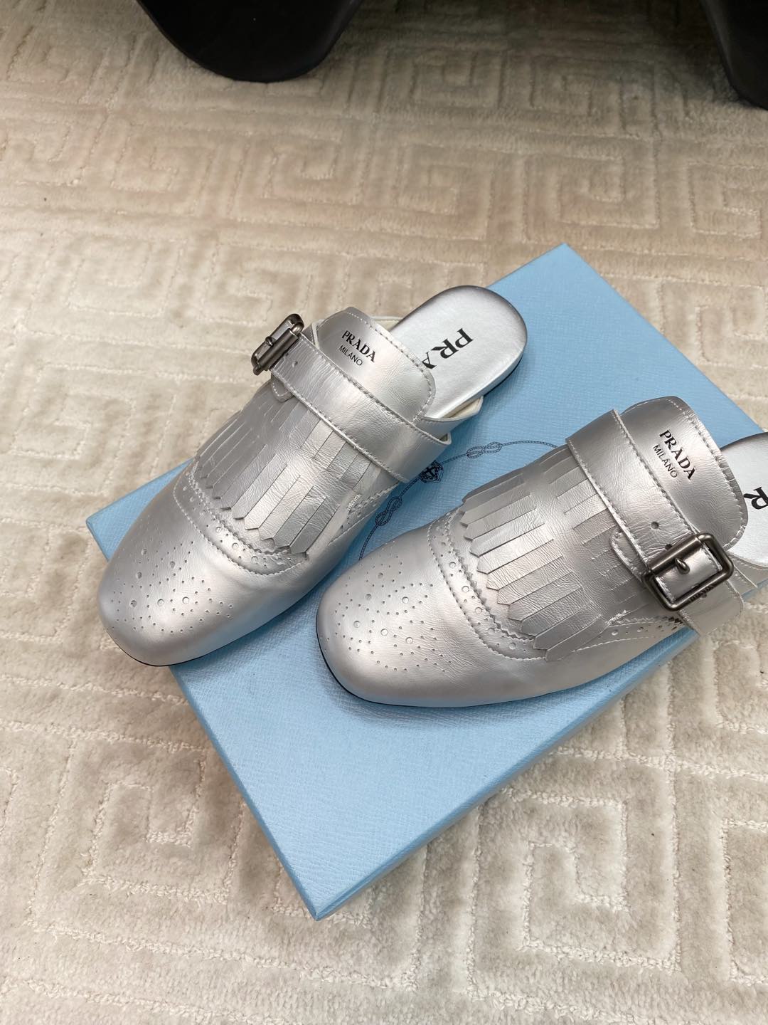 PRADA TASSEL MULES IN SILVER METALLIC LAMBSKIN