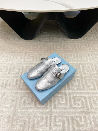 PRADA TASSEL MULES IN SILVER METALLIC LAMBSKIN