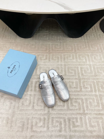 PRADA TASSEL MULES IN SILVER METALLIC LAMBSKIN