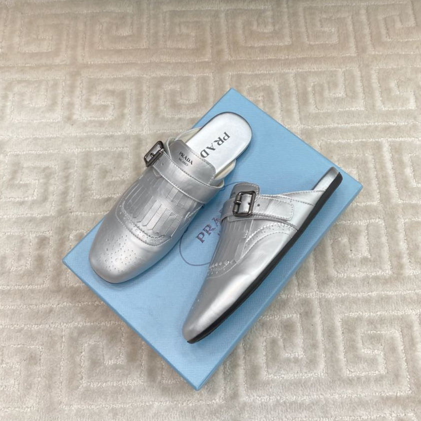 PRADA TASSEL MULES IN SILVER METALLIC LAMBSKIN