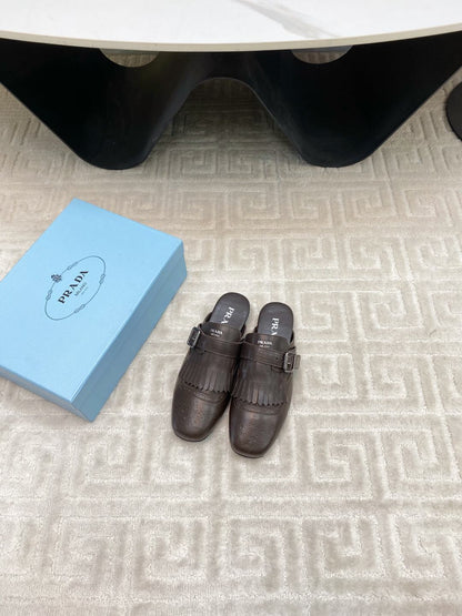 PRADA TASSEL MULES IN WALNUT BROWN LAMBSKIN