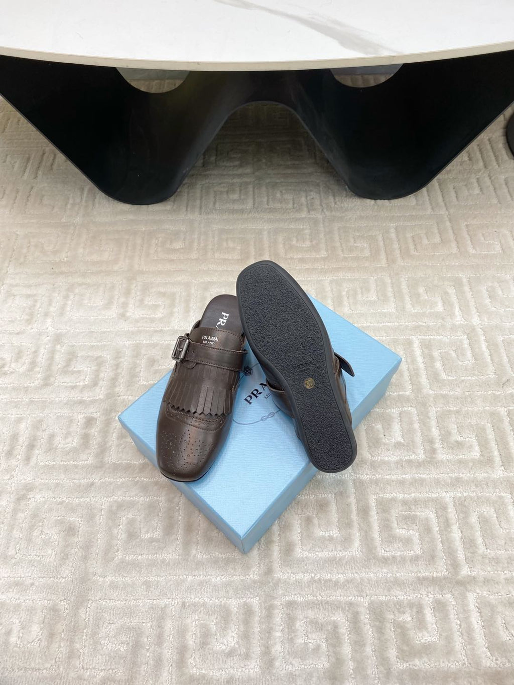 PRADA TASSEL MULES IN WALNUT BROWN LAMBSKIN
