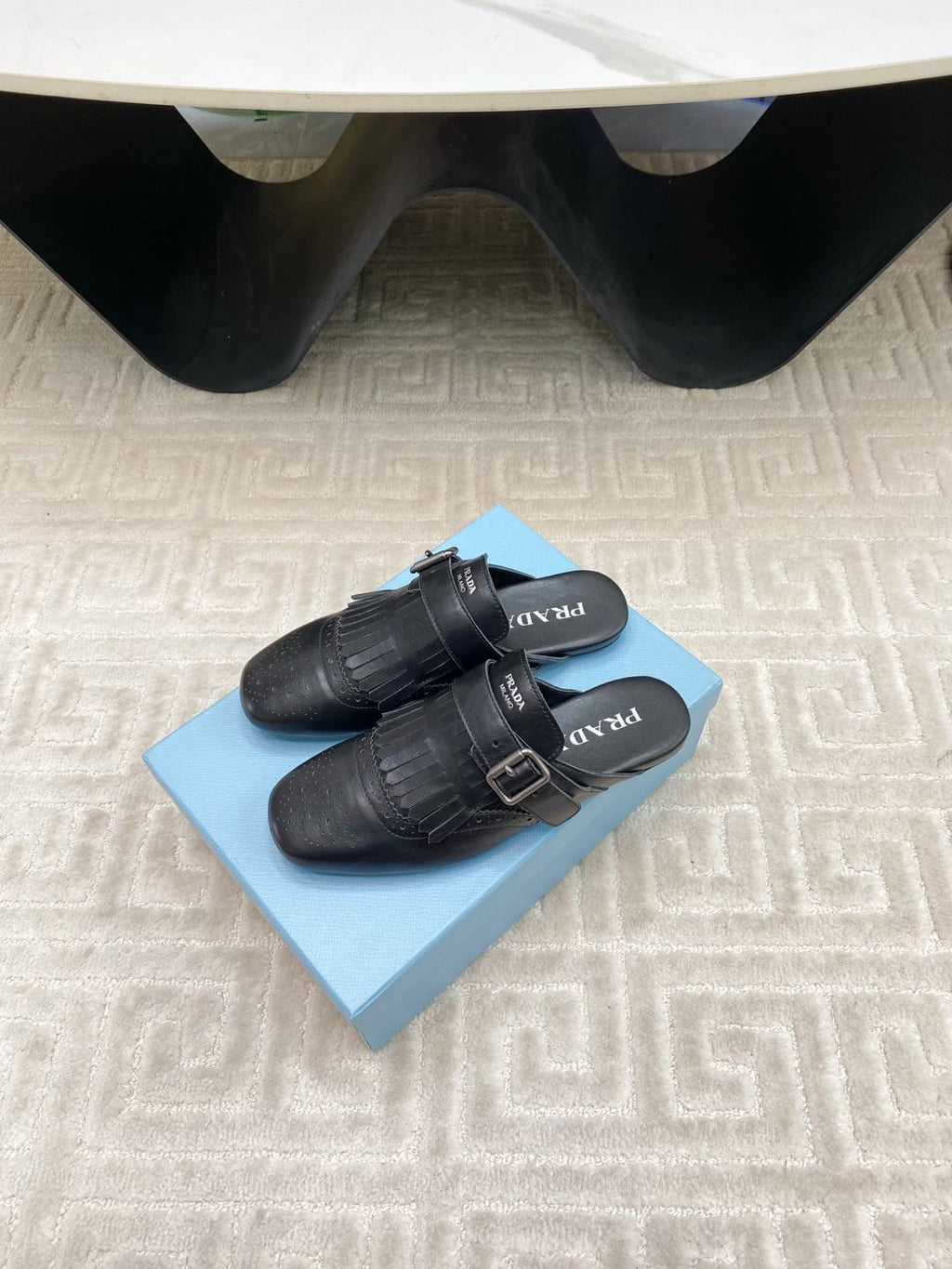 PRADA TASSEL MULES IN BLACK LAMBSKIN
