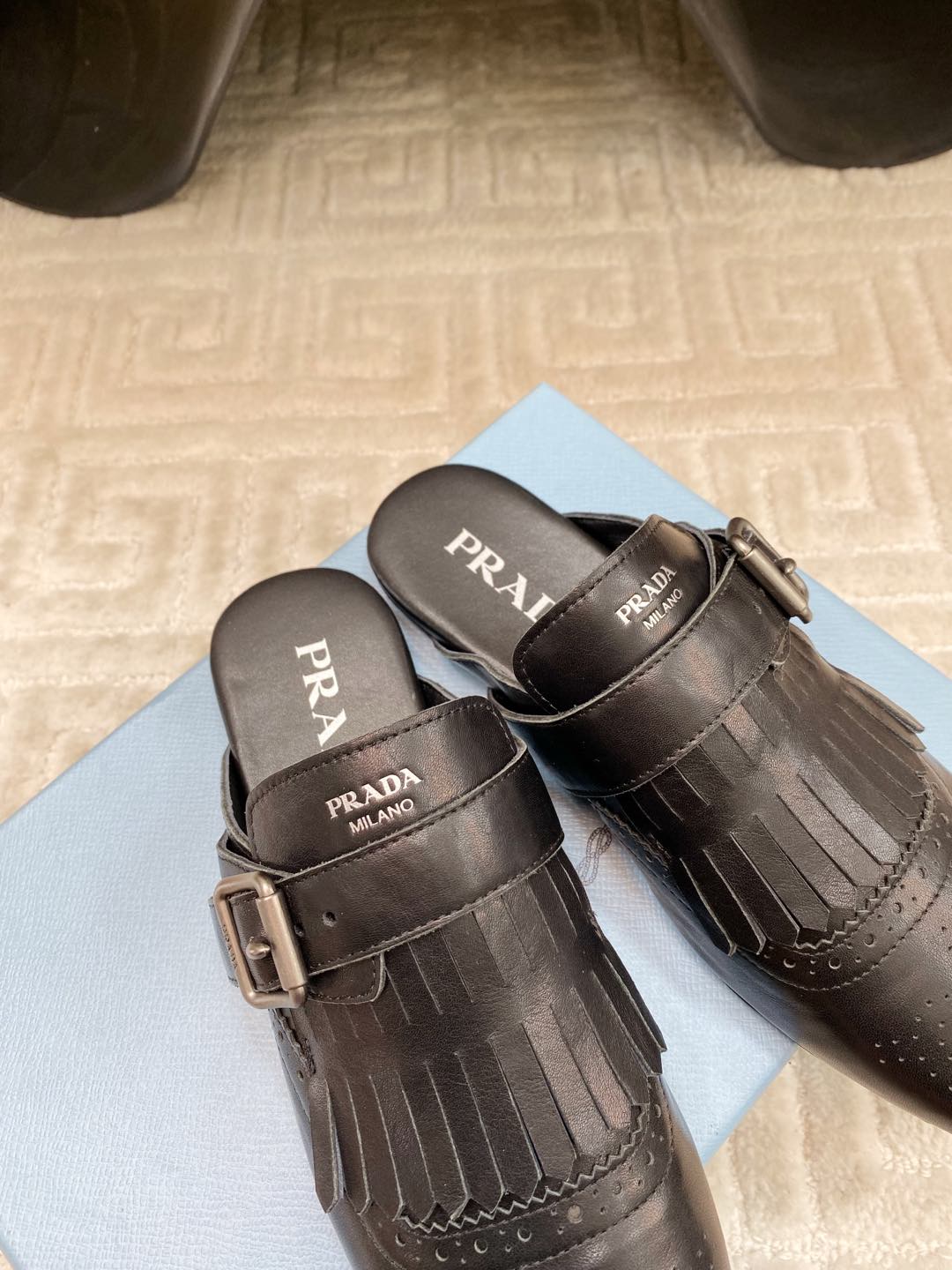 PRADA TASSEL MULES IN BLACK LAMBSKIN