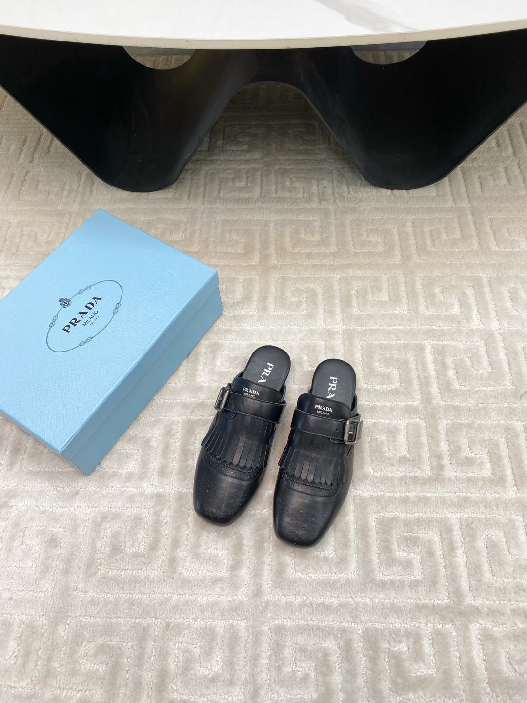 PRADA TASSEL MULES IN BLACK LAMBSKIN