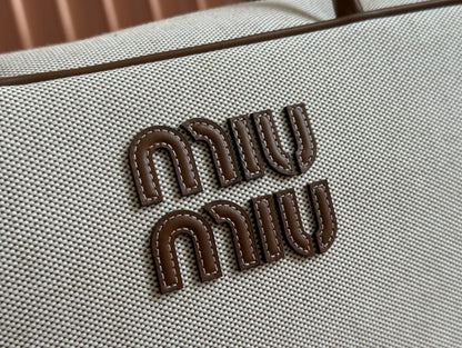 MIU MIU BEAU TOP HANDLE BAG 34 IN WHITE CANVAS AND WALNUT BROWN CALFSKIN TRIM