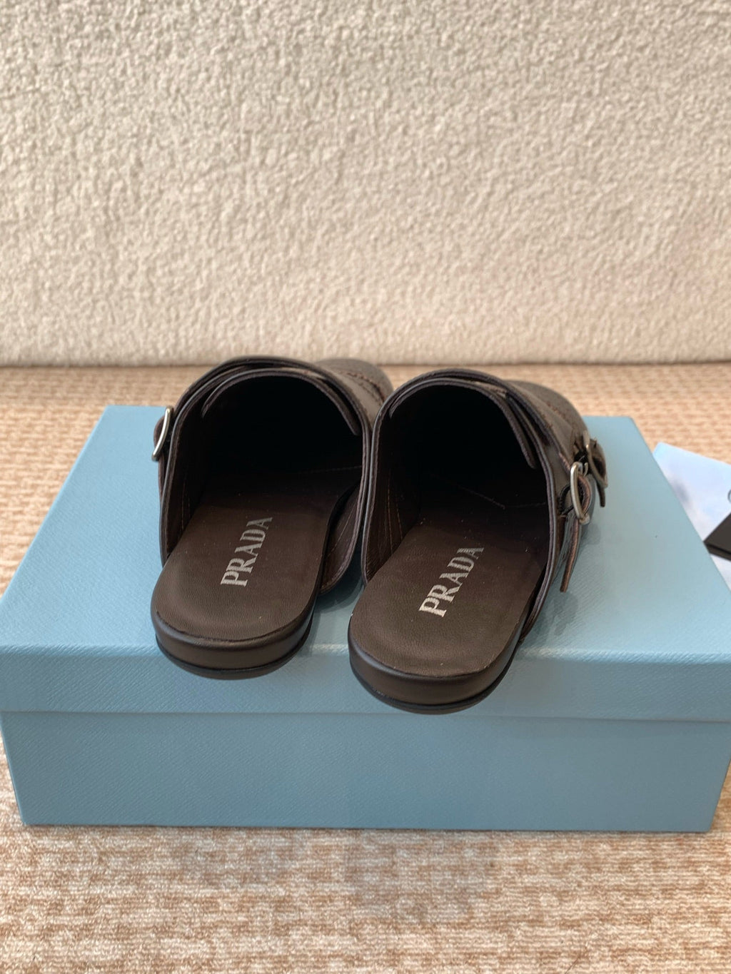 PRADA DOUBLE MONK MULES IN WALNUT BROWN CALFSKIN