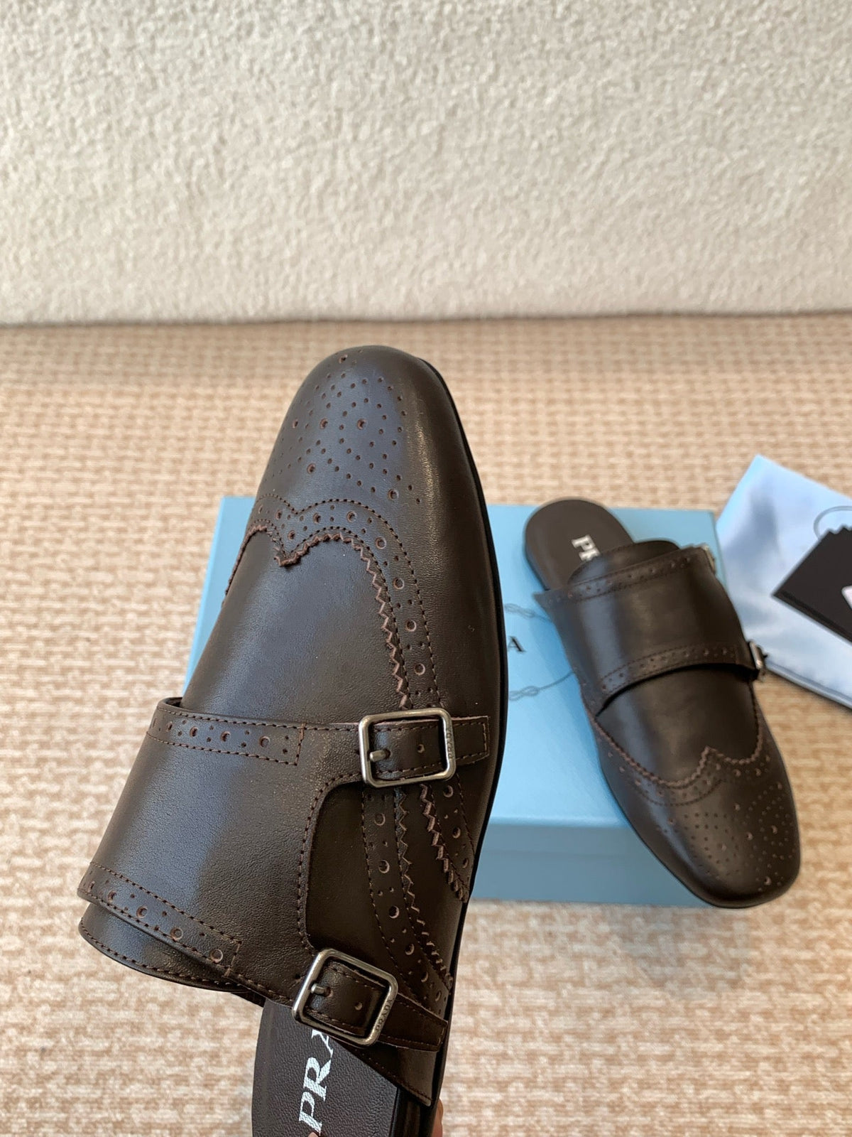 PRADA DOUBLE MONK MULES IN WALNUT BROWN CALFSKIN